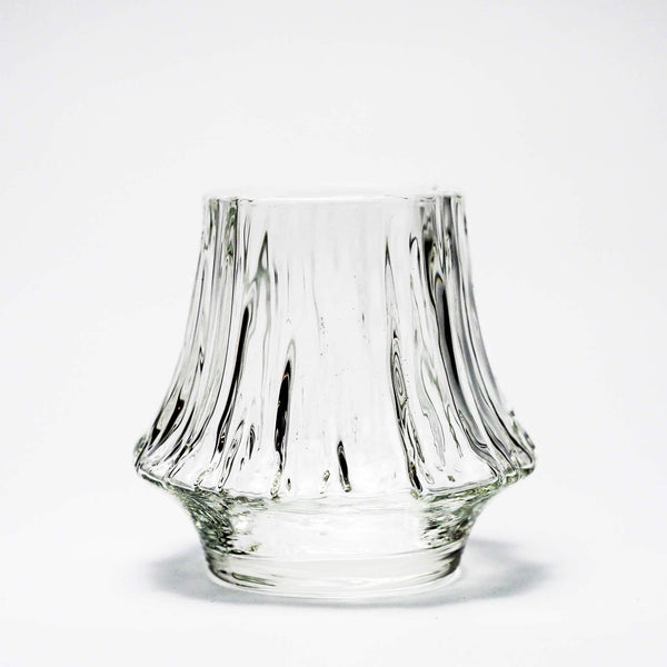 Clear crystal whisky tumbler with fluted design and rounded base