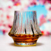 Fluted crystal whisky glass filled with amber whisky