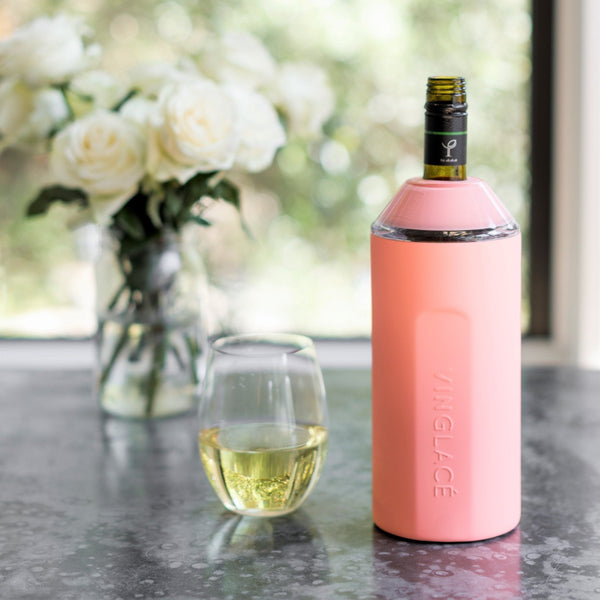 Pink VINGLACE wine cooler with bottle, wine glass, and floral centerpiece