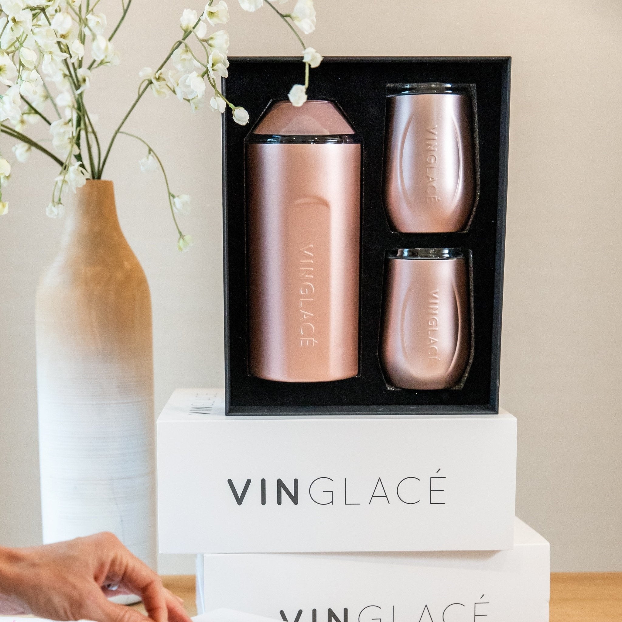 Rose gold wine bottle cooler and two tumblers in presentation box