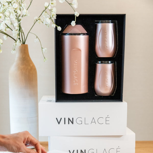 Rose gold wine bottle cooler and two tumblers in presentation box