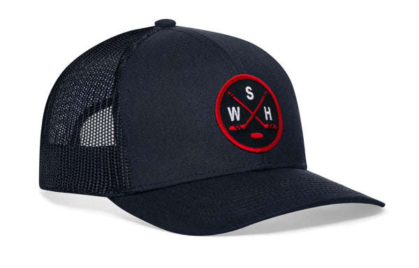 Navy trucker cap with red-and-white logo patch and navy mesh side panels, curved brim.
