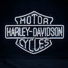 Harley-Davidson motorcycle neon sign with white-blue glowing Harley text and logo